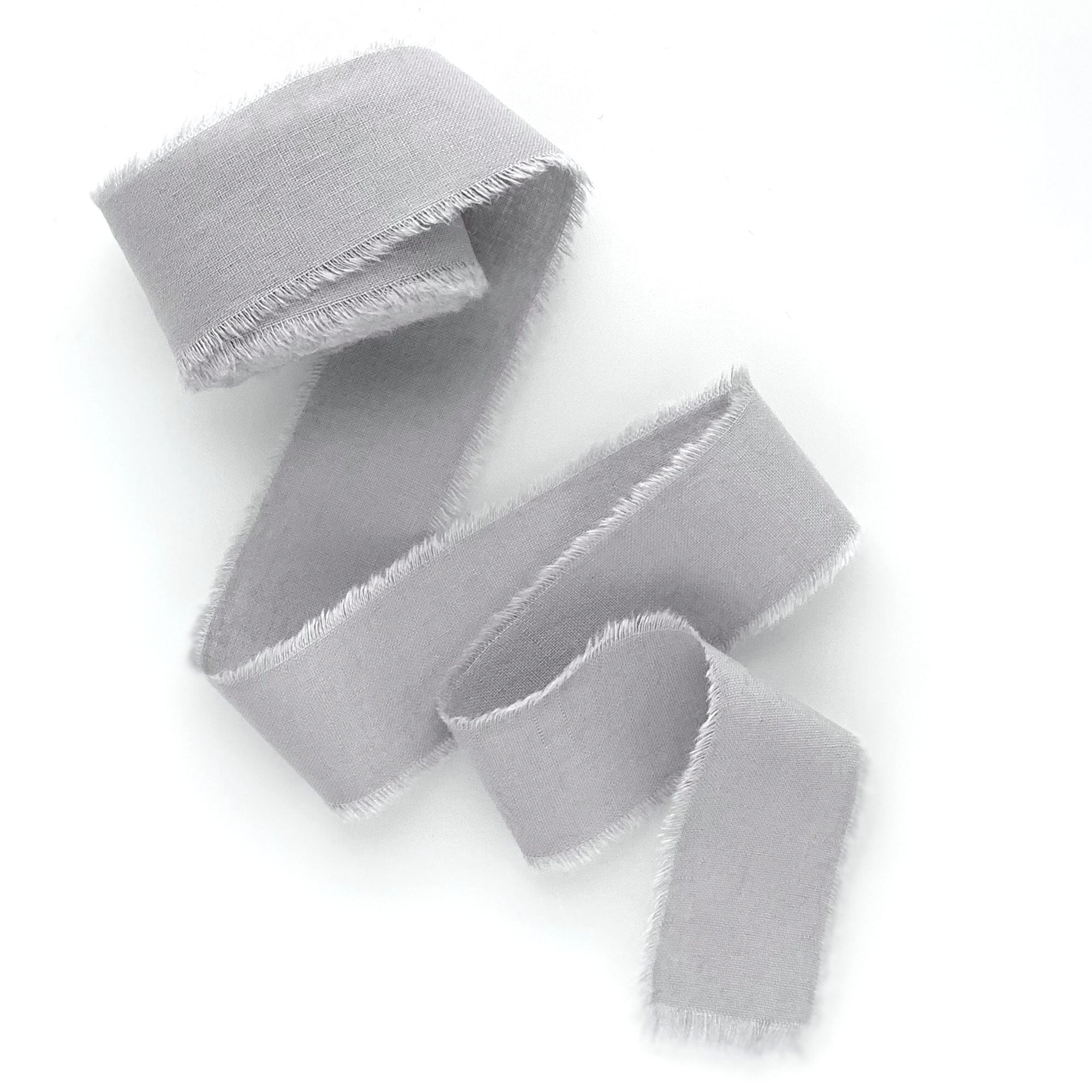 Light grey silk cotton hand dyed ribbon with frayed edges