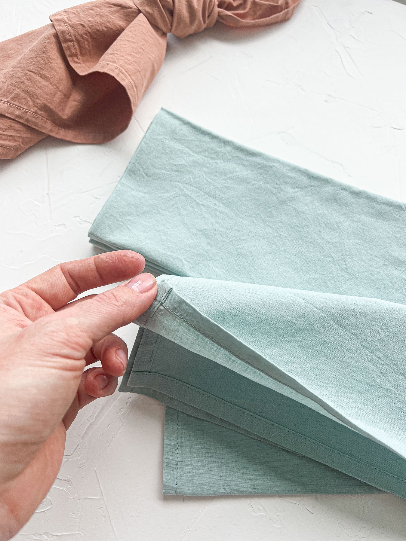 detail of handmade dusty sage napkins