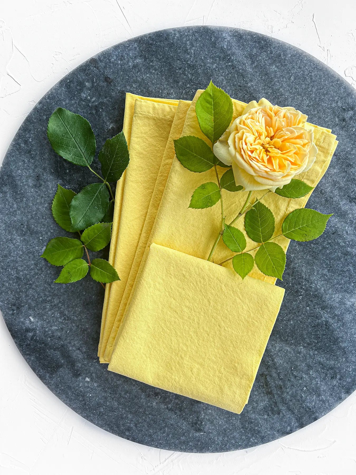 Yellow washed cotton napkins set 4 on plate