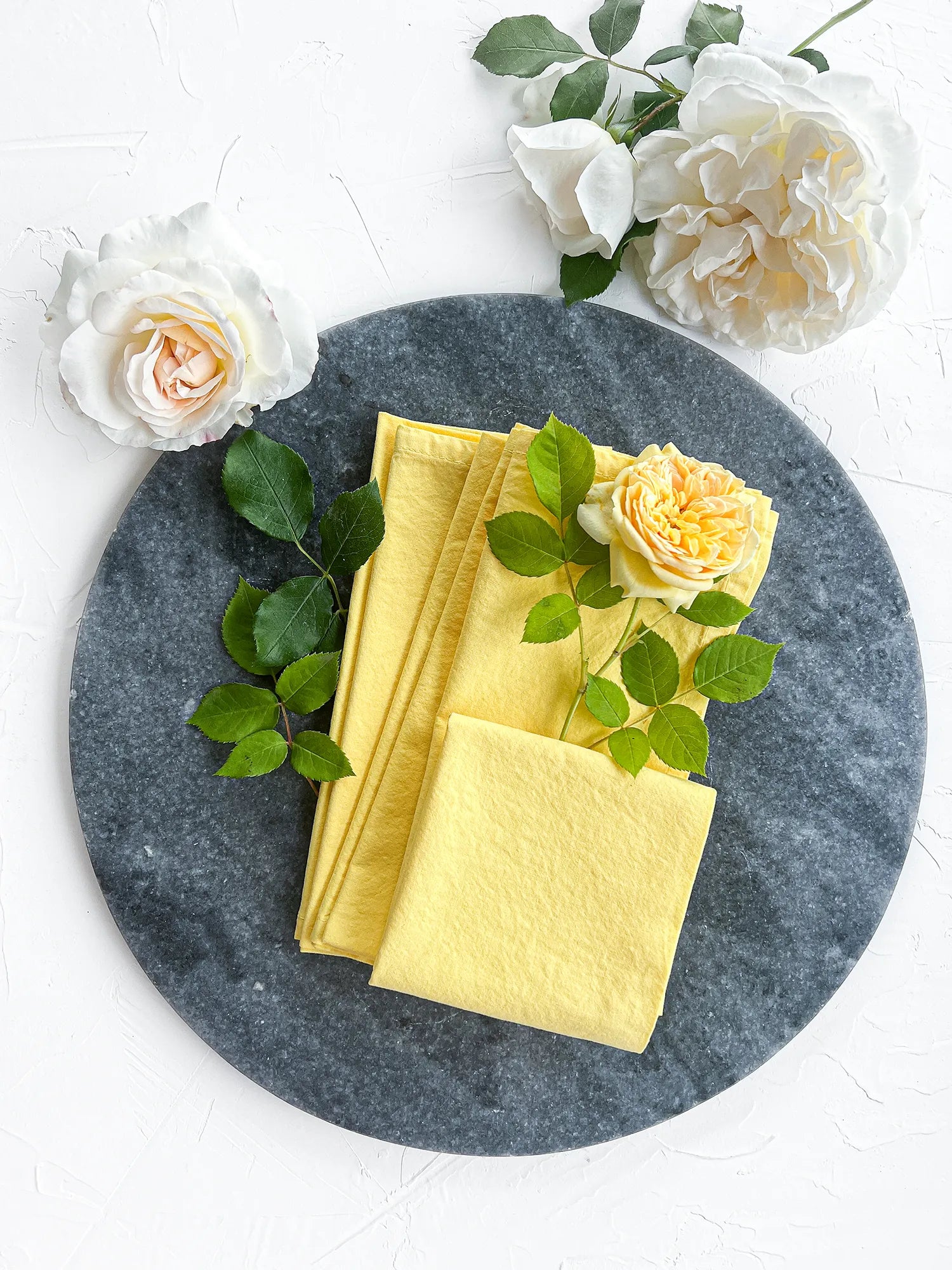 Yellow cotton handmade napkins set on plate